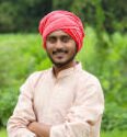 indian farmer at green onion agriculture field.